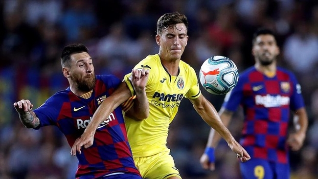  កីឡាករ Pau Torres និងកីឡាករ Lionel Messi